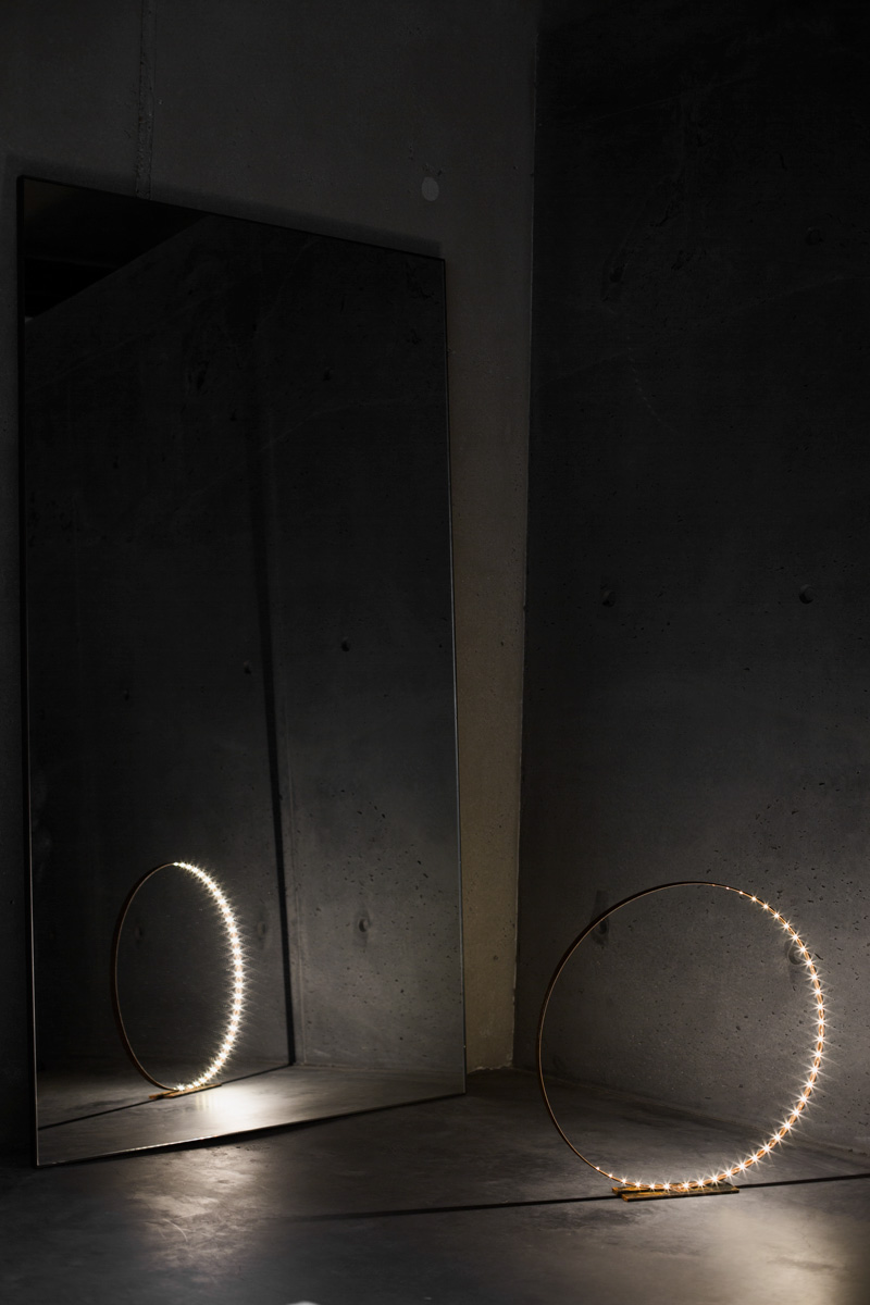 A photograph of Silhouet Lighting Circle with mirror and concrete at ETQ Store by Poppyonto