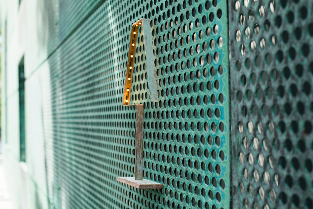 A photograph of Silhouet Lighting Lamp on a dotted wall of Stadsgenoot Amsterdam by Poppyonto