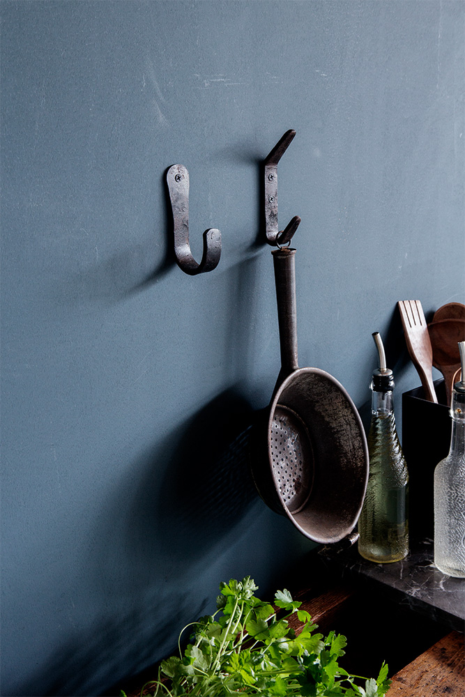 campaign photography Brut Amsterdam color blue wall hooks kitchen by Poppyonto