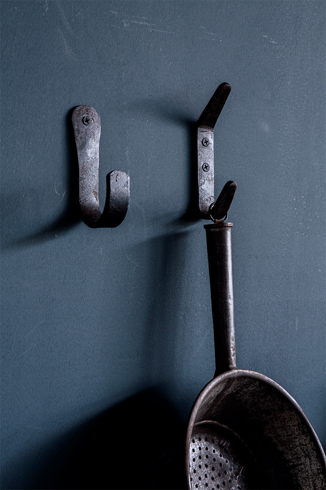 campaign photography Brut Amsterdam color blue wall hooks kitchen by Poppyonto